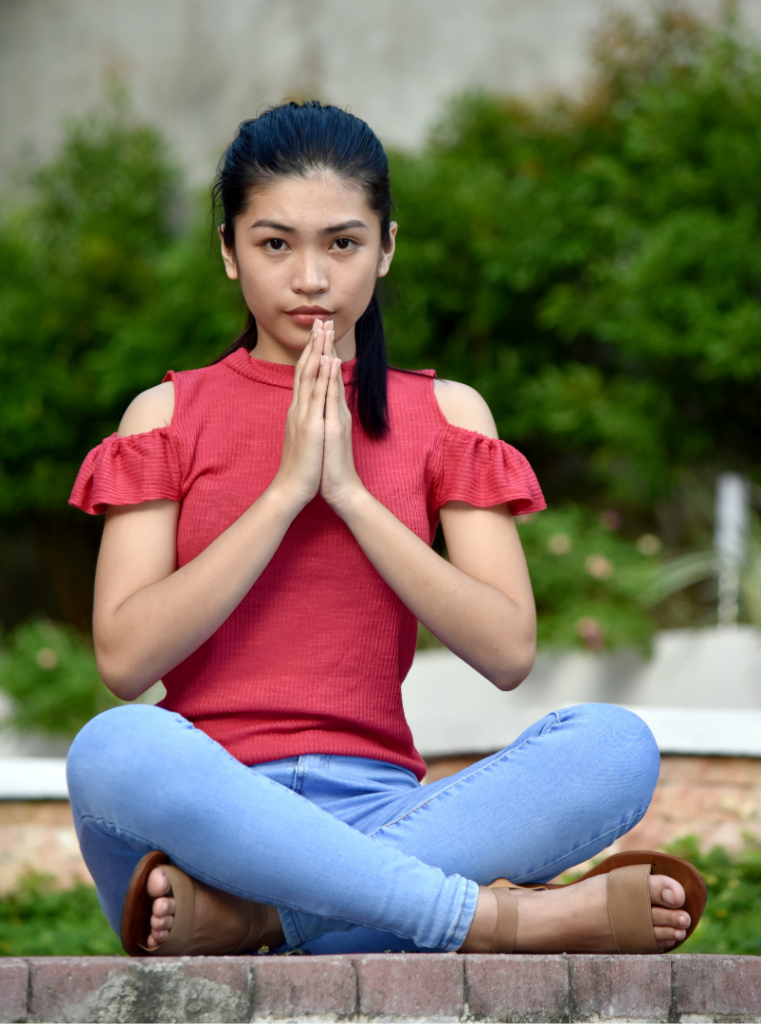 The image shows a student practicing mindfulness.